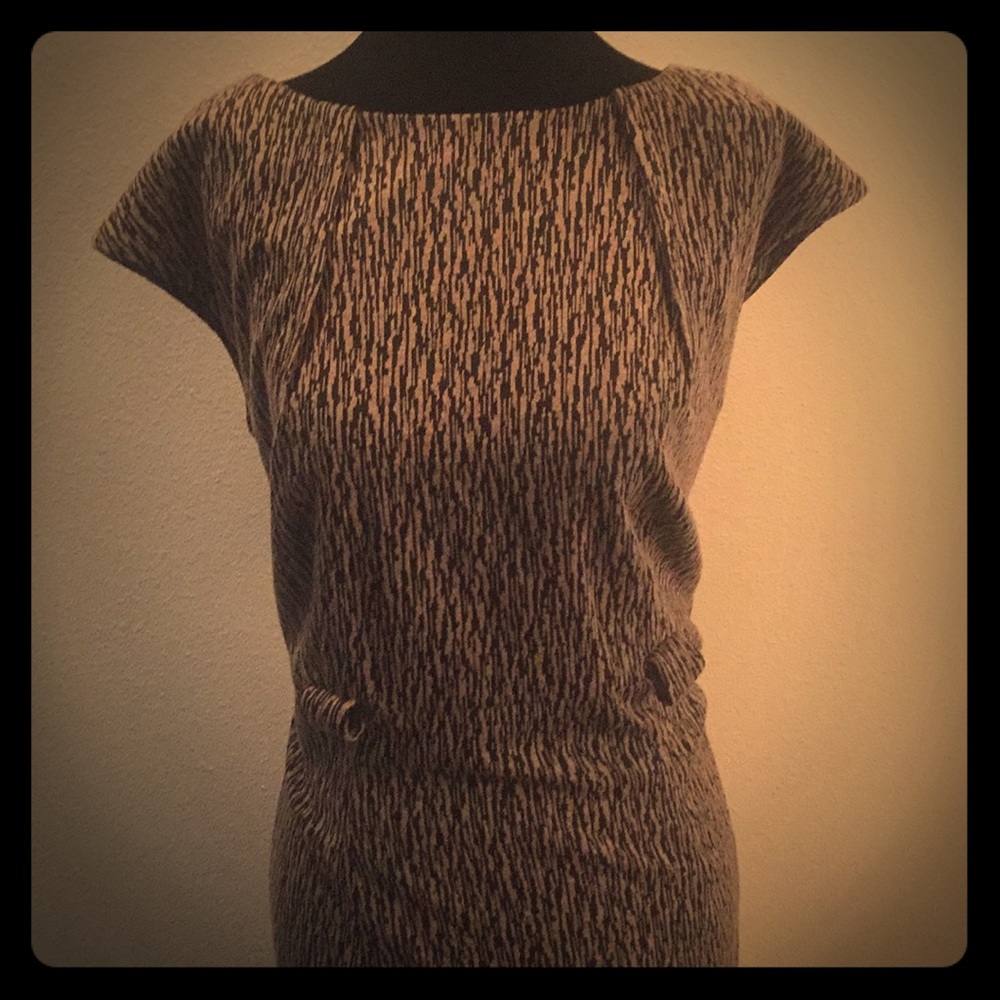 Houndstooth? Brown and black with zip up back.
